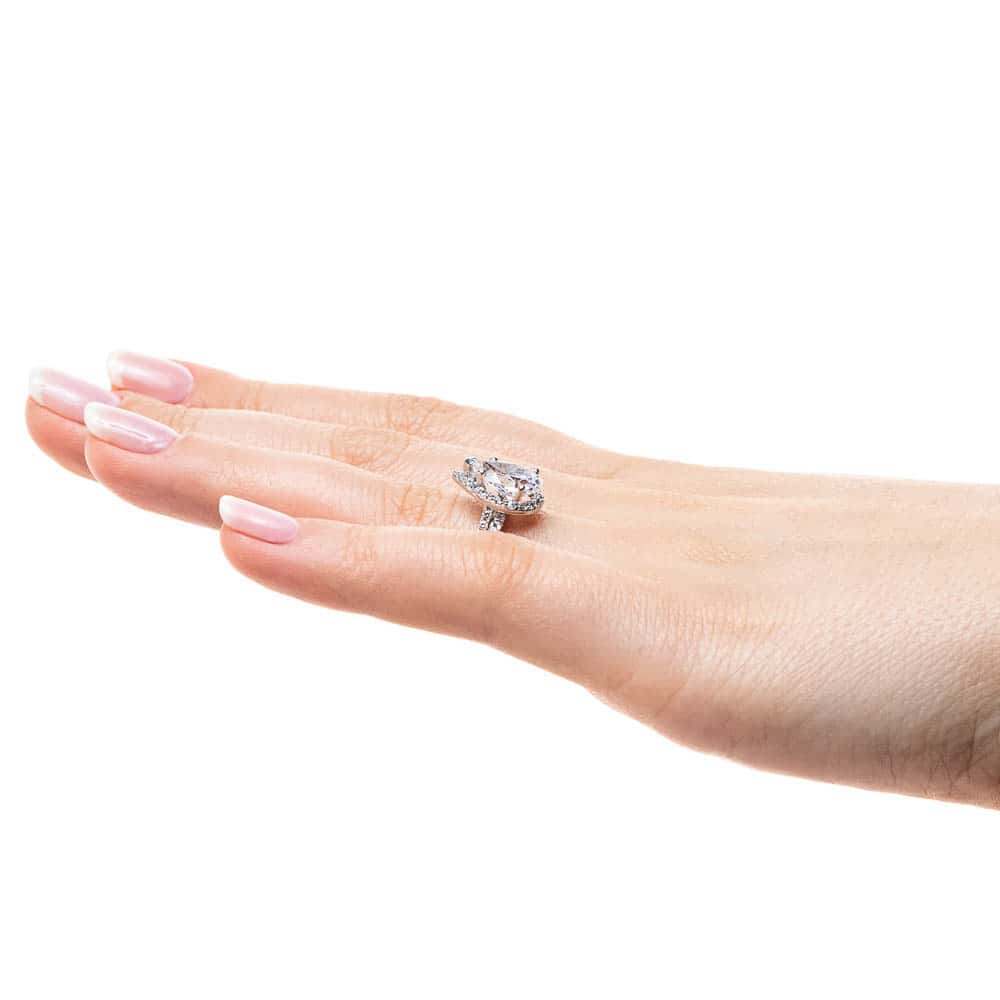 Shown with a 1.91ct Pear cut Lab-Grown Diamond in recycled 14K white gold with matching wedding band