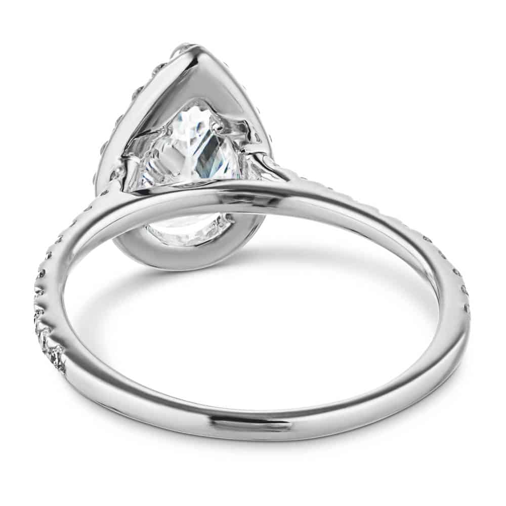 Shown with a 1.0ct Pear cut Lab-Grown Diamond with a diamond accented halo and band in recycled 14K white gold 