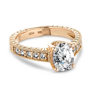 Beautiful antique style diamond accented engagement ring with milgrain and filigree detailing around a 1ct oval cut lab diamond in 14k rose gold