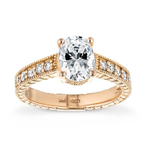 Unique vintage style diamond accented engagement ring with milgrain and filigree detailing around a 1ct oval cut lab diamond in 14k rose gold