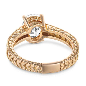 Antique style diamond accented engagement ring with milgrain and filigree detailing around a 1ct oval cut lab diamond in 14k rose gold shown from back