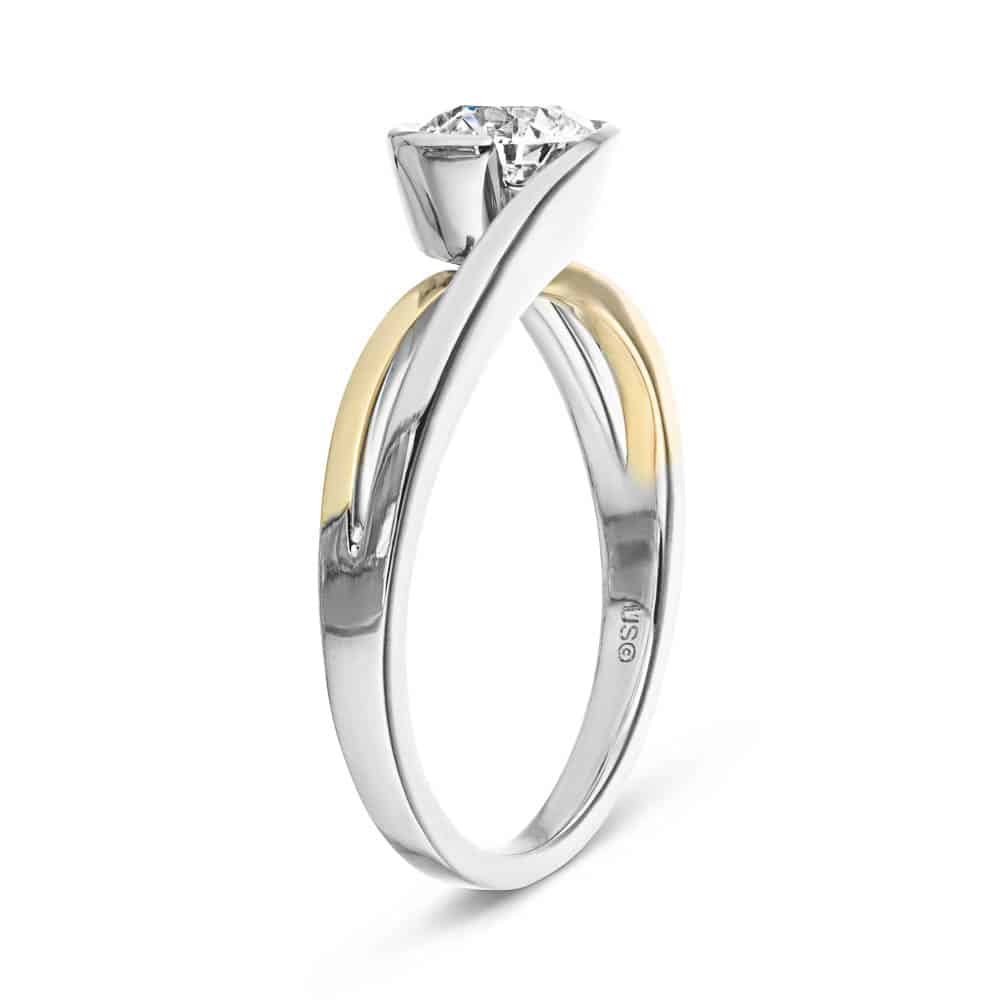 Shown with 1ct Round Cut Lab Grown Diamond in Two Tone 14k White & Yellow Gold|Modern two tone engagement ring with 1ct round cut lab grown diamond in a split shank 14k white gold and 14k yellow gold setting