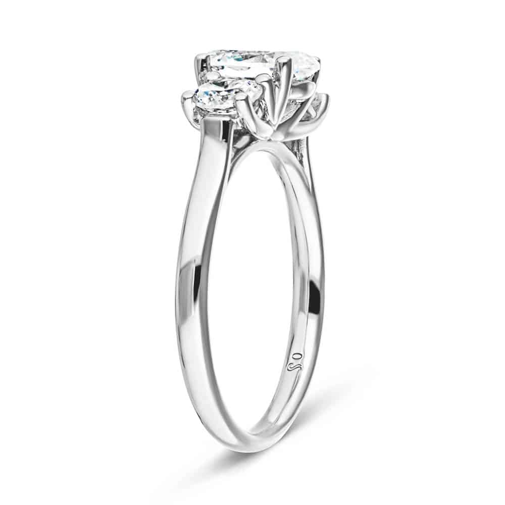 Shown with 1ct Oval Cut and Two 0.5ct Round Cut Lab Grown Diamonds in 14k White Gold|Romantic three stone engagement ring with 1ct oval cut lab grown diamond and two 0.5ct round cut lab diamond side stones in 14k white gold