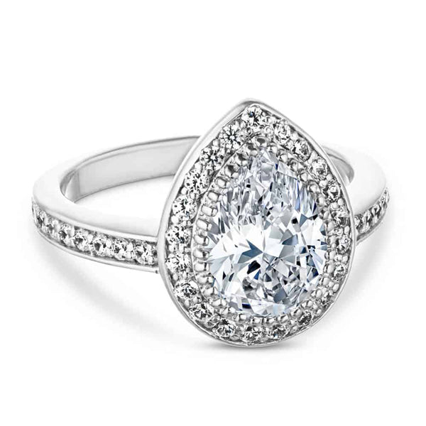 Shown with 1ct Pear Cut Lab Grown Diamond in 14k White Gold|Celebrity Katherine Heigl style engagement ring with channel set diamond accents and a halo surrounding a 1ct pear cut lab grown diamond set in 14k white gold