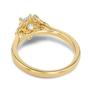 diamond accented engagement ring with round cut lab grown diamond center stone set in 14k yellow gold metal