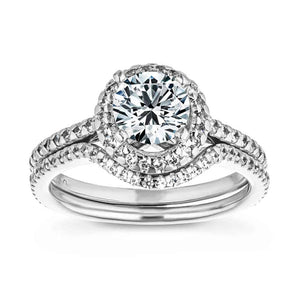  diamond accented halo engagement ring Shown with a 1.0ct Round cut Lab-Grown Diamond with a diamond accented halo and band in recycled 14K white gold with matching wedding band
