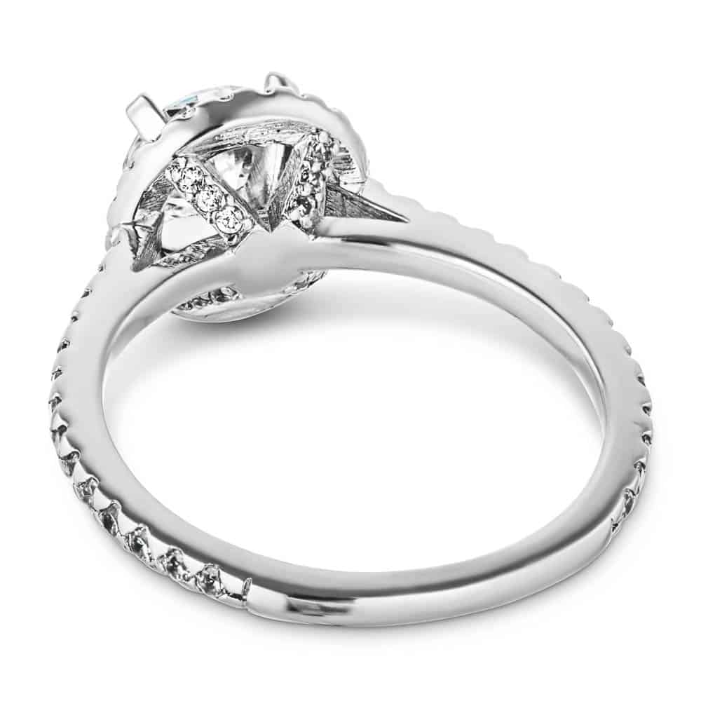 Shown with a 1.0ct Round cut Lab-Grown Diamond with a diamond accented halo and band in recycled 14K white gold 