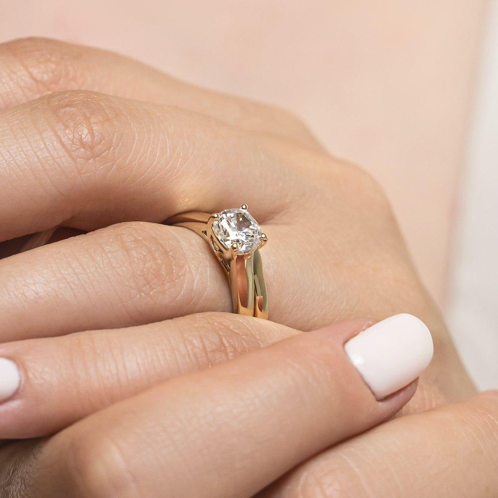 Shown with a 1.0ct Round cut Lab-Grown Diamond in recycled 14K yellow gold with matching wedding band 