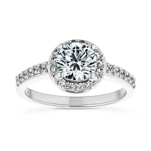 Stunning channel set diamond accented halo engagement ring with 0.5ct round cut lab grown diamond center stone in 14k white gold
