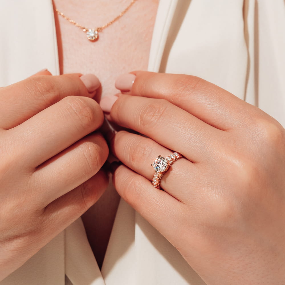 Shown with a 1ct Lab Grown Diamond in 14k Rose Gold|Maeve diamond accented vintage style engagement ring with milgrain detailing and a 1ct lab grown diamond center stone in 14k rose gold