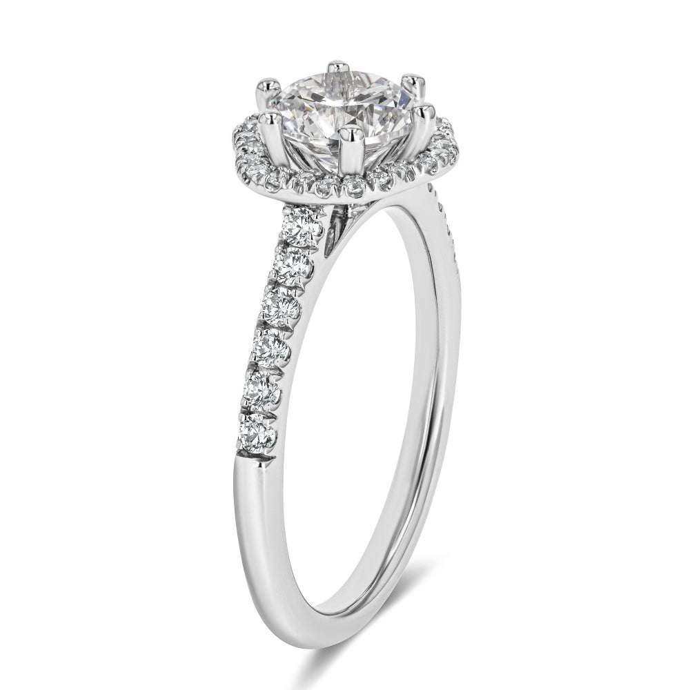Shown here with a 1.0ct Round Cut Lab Grown Diamond center stone in 14K White Gold|diamond accented halo engagement ring with lab grown diamond center stone set in 14k white gold recycled metal