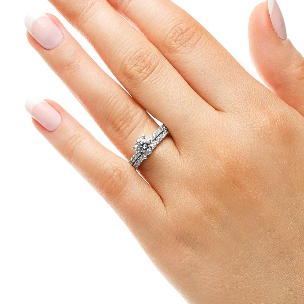 Shown with a 1.0ct Round cut Lab-Grown Diamond with an eternity style diamond band in recycled 14K white gold, can be purchased as a set for a discount