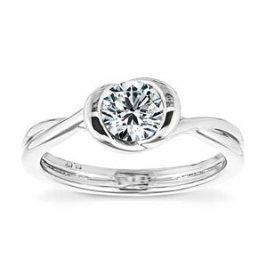 Minimalistic modern solitaire engagement ring with twisted band design holding a 1ct round cut lab grown diamond in platinum setting