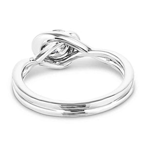 Modern engagement ring with twisted band design holding a 1ct round cut lab grown diamond in platinum setting shown from back