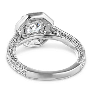Antique style diamond accented halo engagement ring with filigree and milgrain detailing holding a 1ct round cut lab grown diamond in 14k white gold shown from back