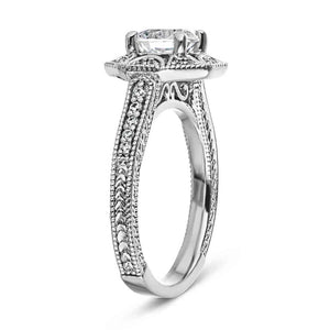 Antique style diamond accented halo engagement ring with filigree and milgrain detailing holding a 1ct round cut lab grown diamond in 14k white gold shown from side