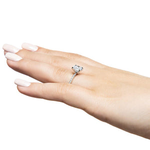 Diamond accented engagement ring with 1ct round cut lab grown diamond in 14k white gold band worn on hand sideview