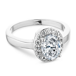 Unique ethical pave set diamond accented halo engagement ring with 1ct oval cut lab grown diamond in platinum setting
