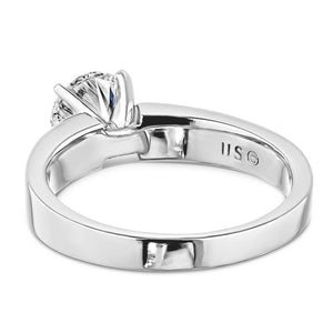 Modern solitaire engagement ring with 1ct round cut lab grown diamond in thick 14k white gold band shown from back