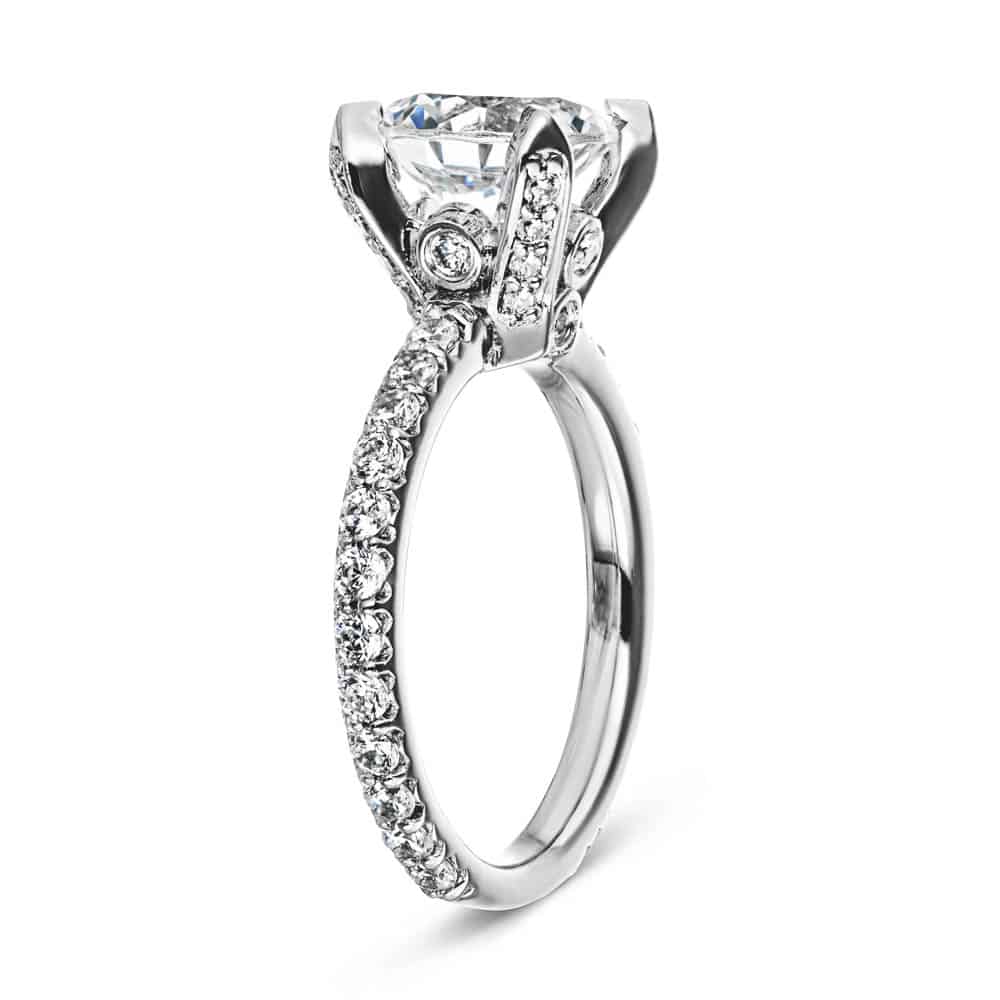 Shown with 1.5ct Round Cut Lab Grown Diamond in 14k White Gold|Beautiful vintage style diamond accented engagement ring with peek-a-boo diamonds under a 1.5ct round cut lab grown diamond in a 14k white gold setting