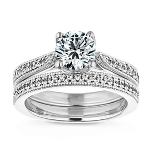  two tone engagement ring Shown with a 1.0ct Round cut Lab-Grown Diamond with diamond accented halo and filigree detailed band in recycled 14K white gold with matching wedding band
