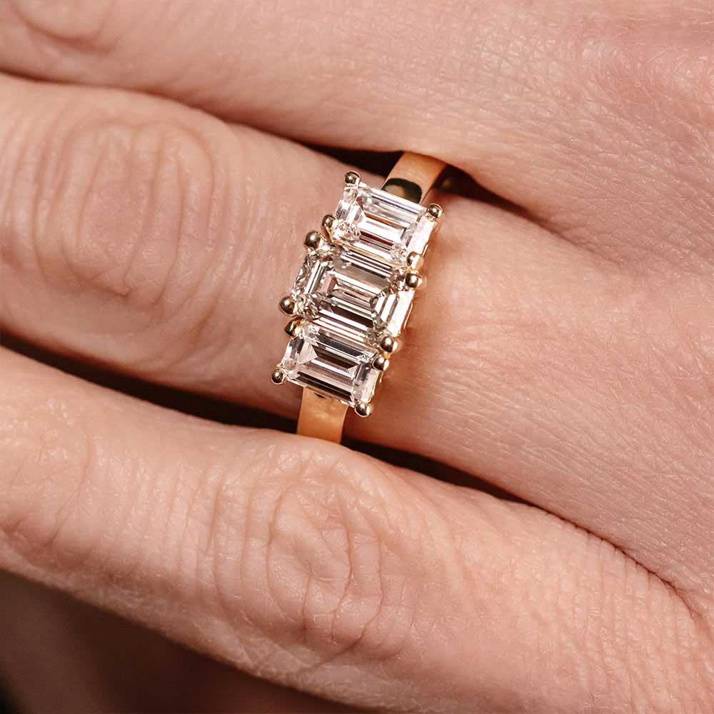 Shown with Emerald Cut Lab Grown Diamonds in 14k Yellow Gold|kim kardashian look-a-like engagement ring with three emerald cut lab grown diamonds in 14k yellow gold band