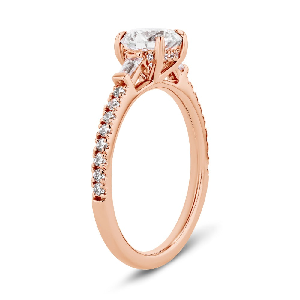 Shown here with a 1.0ct Round Cut Lab Grown Diamond center stone in 14K Rose Gold|diamond accented engagement ring with round cut lab grown diamond center stone set in 14k rose gold metal