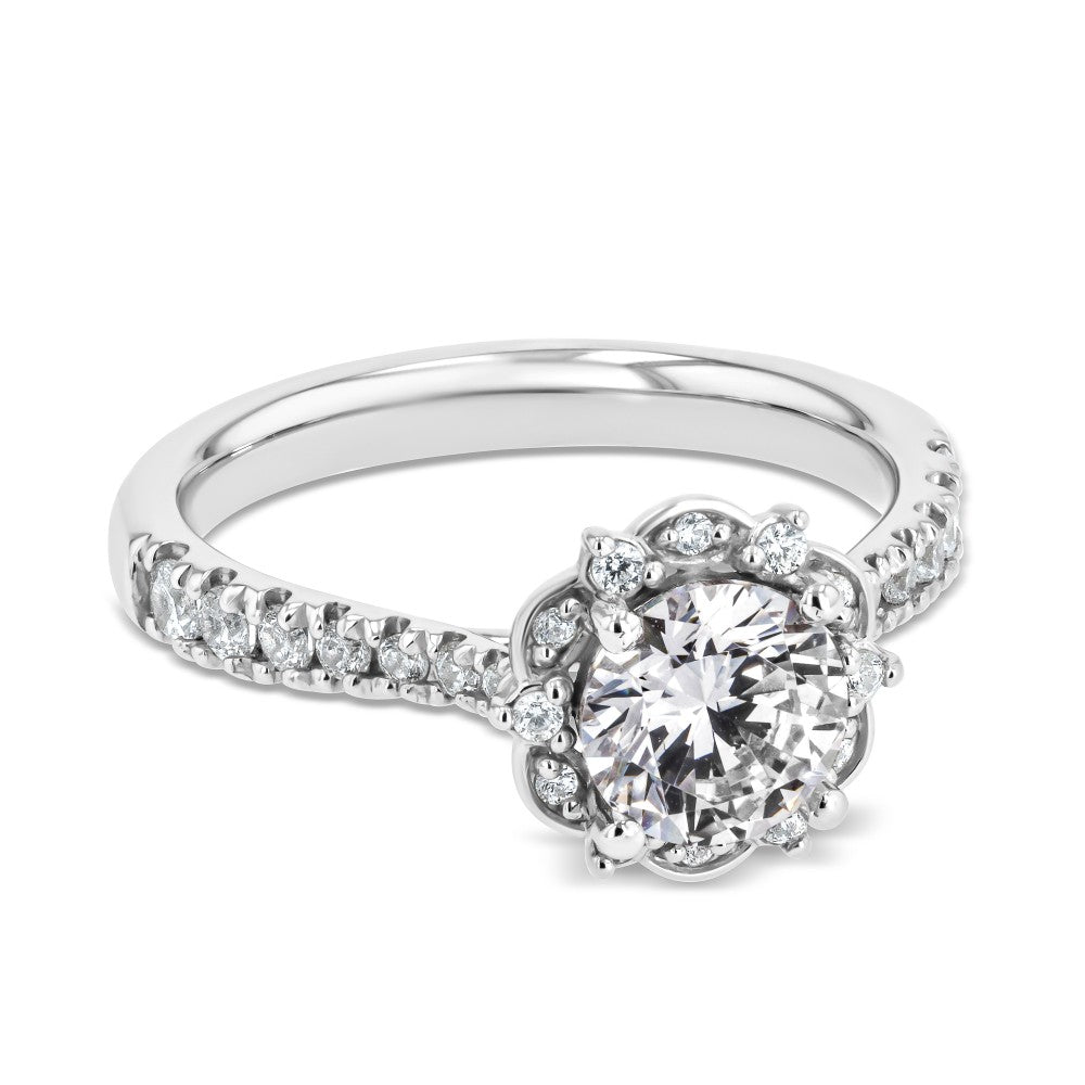 Shown here with a 1.0ct Round Cut Lab Grown Diamond center stone in 14K White Gold|diamond accented halo engagement ring with round cut lab grown diamond center stone set in 14k white gold recycled metal