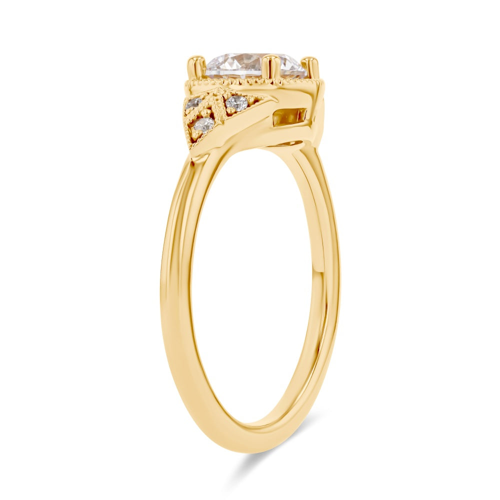 Shown here with a 1.0ct Round Cut Lab Grown Diamond center stone in 14K Yellow Gold|diamond accented engagement ring with round cut lab grown diamond center stone set in 14k yellow gold recycled metal