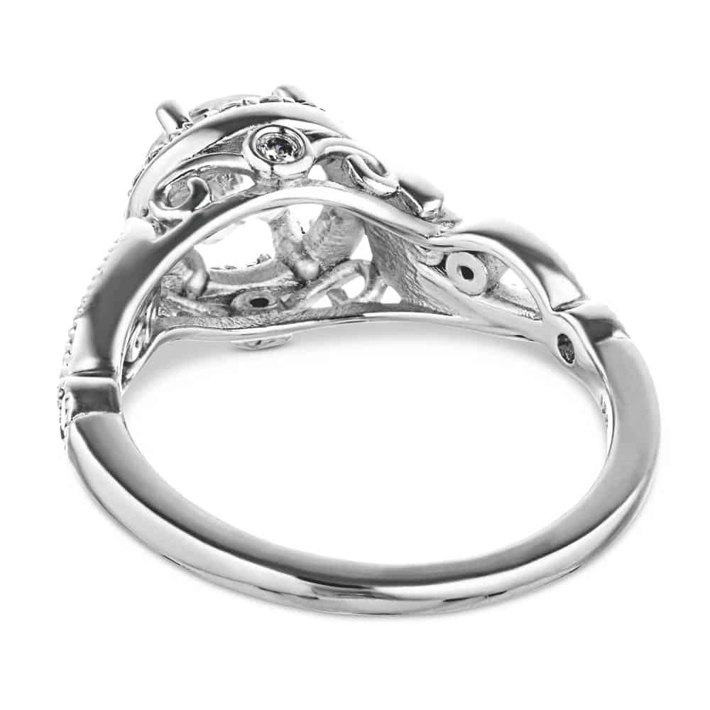 Shown with a 1.0ct Round cut Lab-Grown Diamond with diamond accented halo and filigree detailed band in recycled 14K white gold 