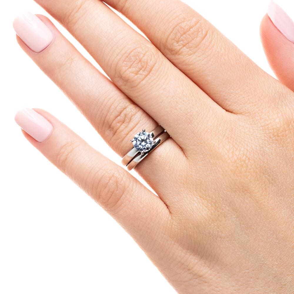 Shown with a 1.0ct Round cut Lab-Grown Diamond in recycled 14K white gold with matching wedding band, can be purchased as a set for a discounted price 