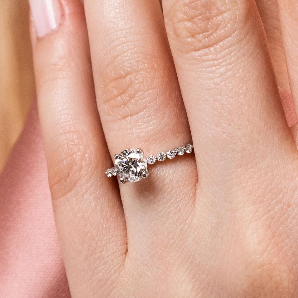 Shown with a 1.0ct Round cut Lab-Grown Diamond with accenting diamonds on the band in recycled 14K white gold | diamond accented engagement ring Shown with a 1.0ct Round cut Lab-Grown Diamond with accenting diamonds on the band in recycled 14K white gold
