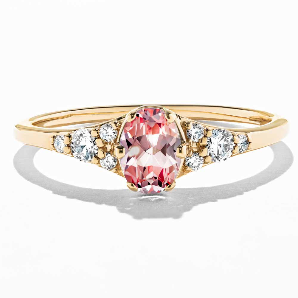 Shown here in 14K Yellow Gold with an Oval Cut Lab Grown Pink Champagne Sapphire