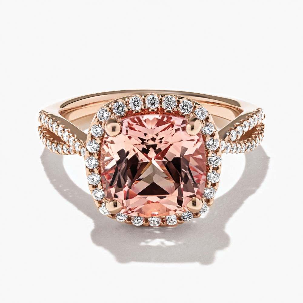 Shown here with a Cushion Cut Lab Created Champagne Pink Sapphire in 14K Rose Gold|diamond accented halo engagement ring with champagne pink sapphire lab created gemstone in 14k rose gold