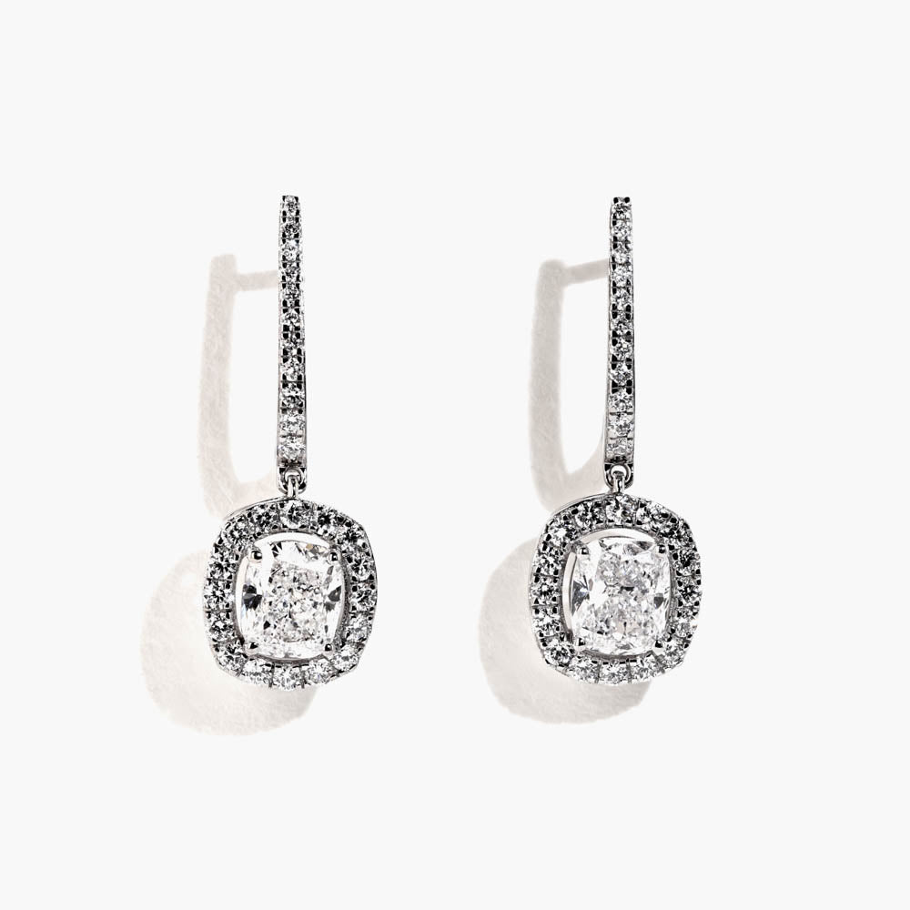 Shown in 14K White Gold|diamond halo drop earrings featuring cushion cut center stones surrounded by lab grown diamonds in white gold by MiaDonna