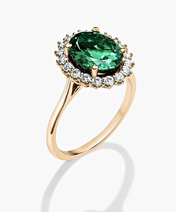 Emerald Gemstone Ring with a Diamond halo Accented.