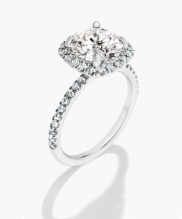 Vintage style white gold halo engagement ring with a sustainable lab grown diamond