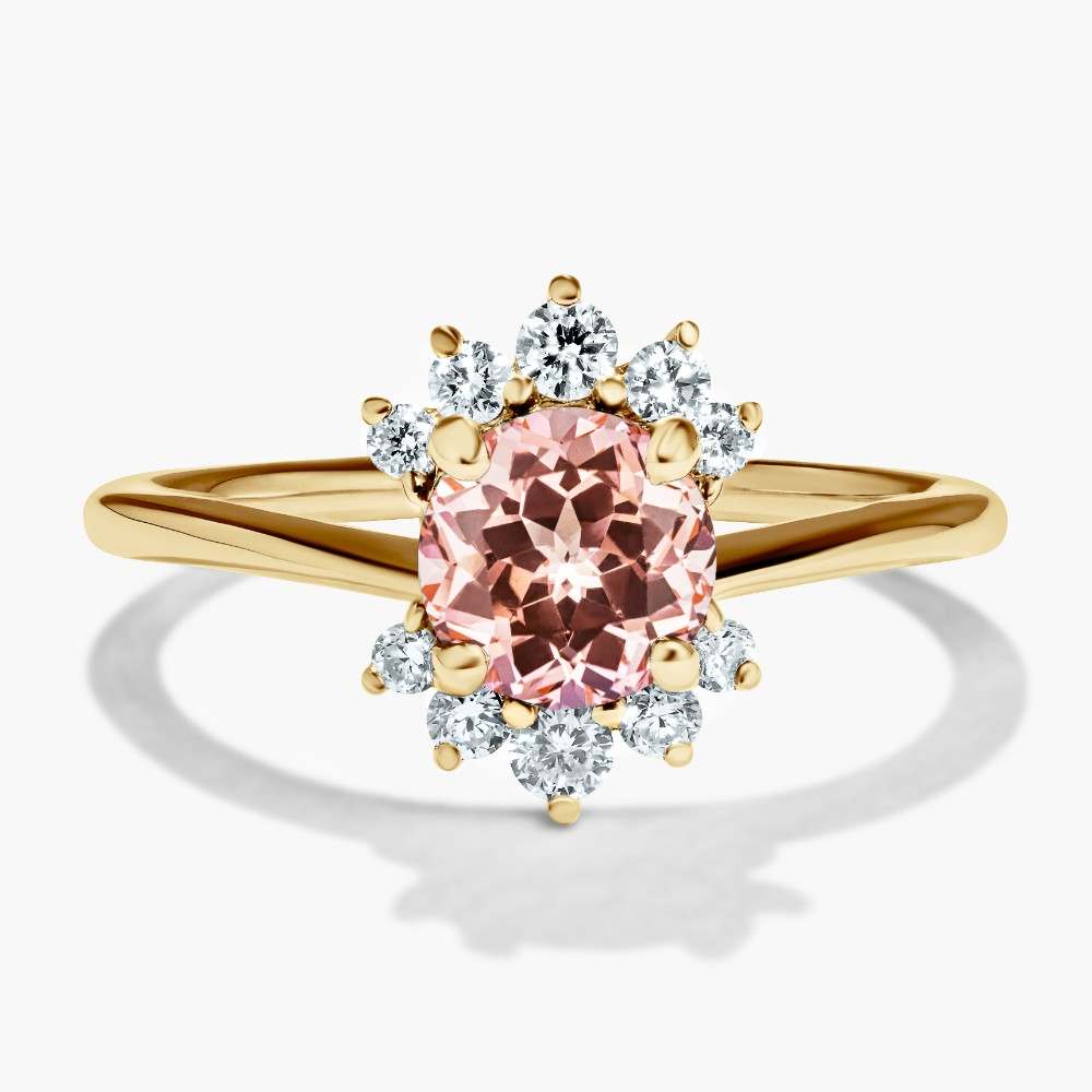 Shown here in 14K Yellow Gold with a Round Cut Pink Champagne Sapphire|floral design halo engagement ring with accenting lab grown diamonds and a pink champagne sapphire center stone by MiaDonna