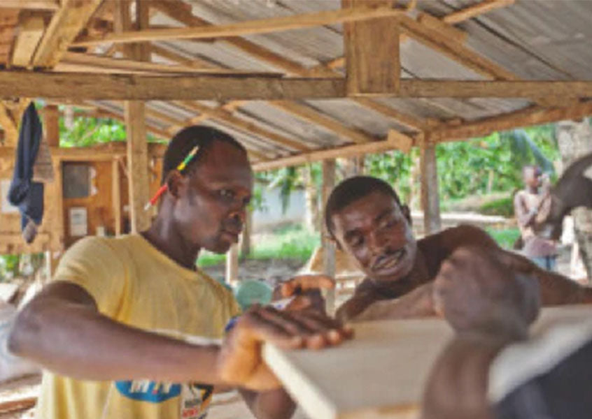 A student receives carpentry training at The Greener Diamond partnership SOS TECHNICAL SCHOOL in TOGO