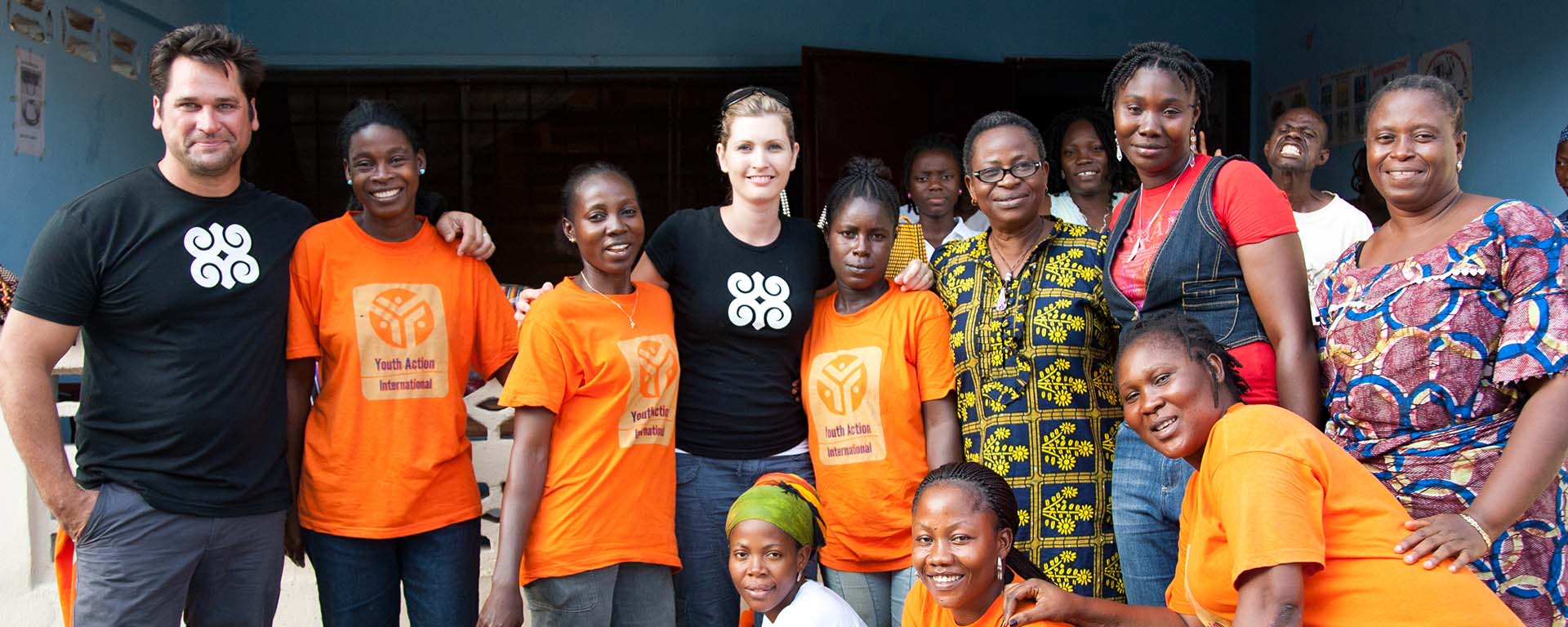 Johnny Littlefield from "Extreme Home Makeover" and MiaDonna's Founder Anna-Mieke Anderson with a group from Youth Action International in Liberia, Africa
