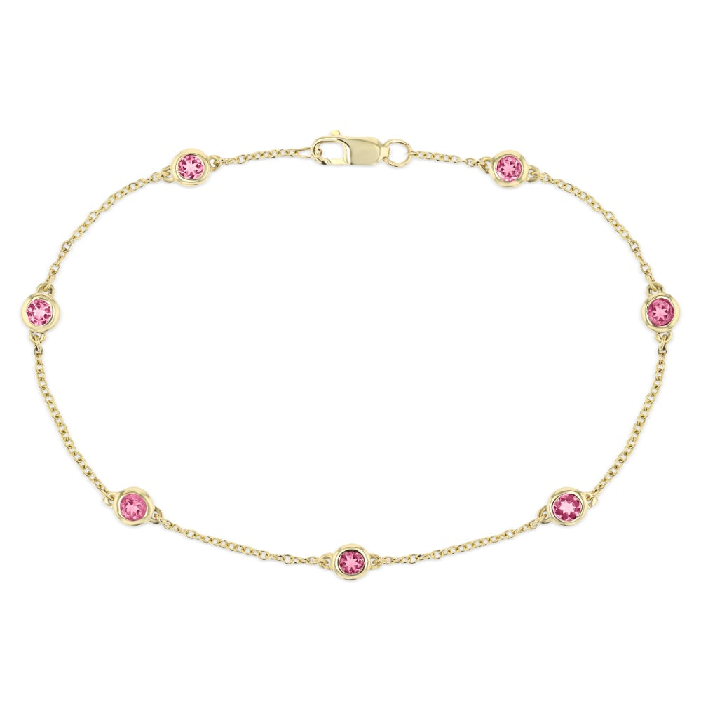 Shown with Lab Created Pink Sapphire Gemstones in 14K Yellow Gold|Woman wearing Pink Sapphire Bezel Station Chain Bracelet in 14 carat Yellow Gold from Lab Grown Gemstone specialists MiaDonna 
