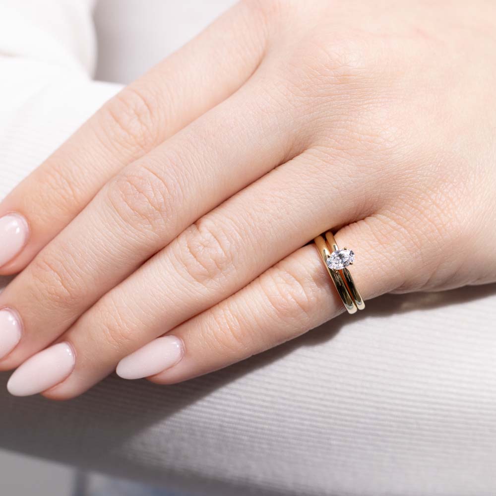 Shown in 14K Yellow Gold with an Oval Cut Center Stone paired with the Dior Stackable Band