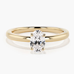 traditional solitaire engagement ring in 14k recycled yellow gold with an oval cut diamond hybrid by MiaDonna