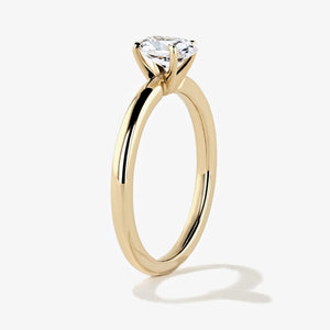 traditional solitaire engagement ring in 14k recycled yellow gold with an oval cut diamond hybrid by MiaDonna