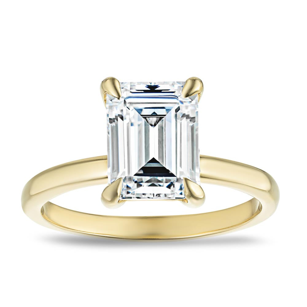 Shown in 14K Yellow Gold with a 2ct Emerald Cut Lab Grown Diamond center stone