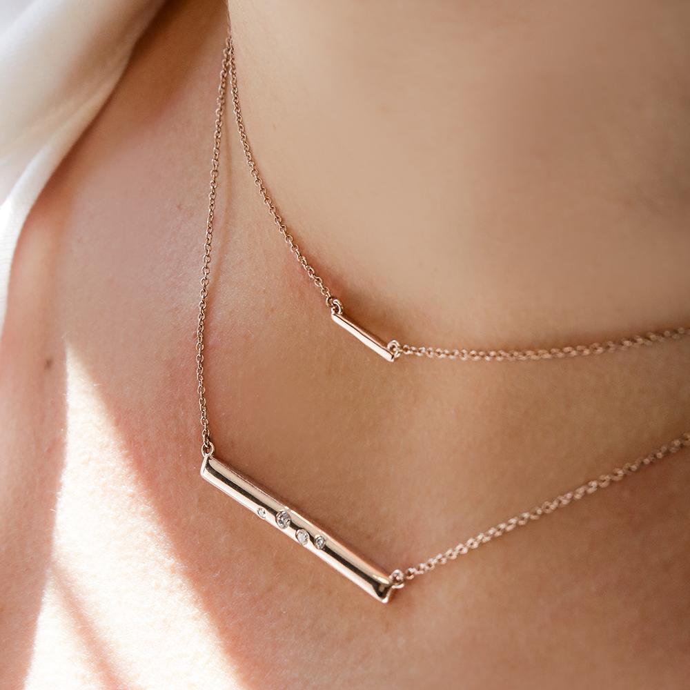 Bar Necklace in 14K yellow gold shown here layered with the Galaxy Bar Necklace 