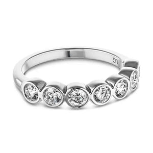 Ethical 7 stone bezel wedding ring with lab grown diamonds in recycled 14k white gold