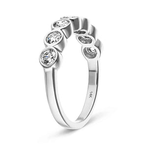 Conflict-free 7 stone bezel anniversary band with lab grown diamonds in 14k white gold shown from side