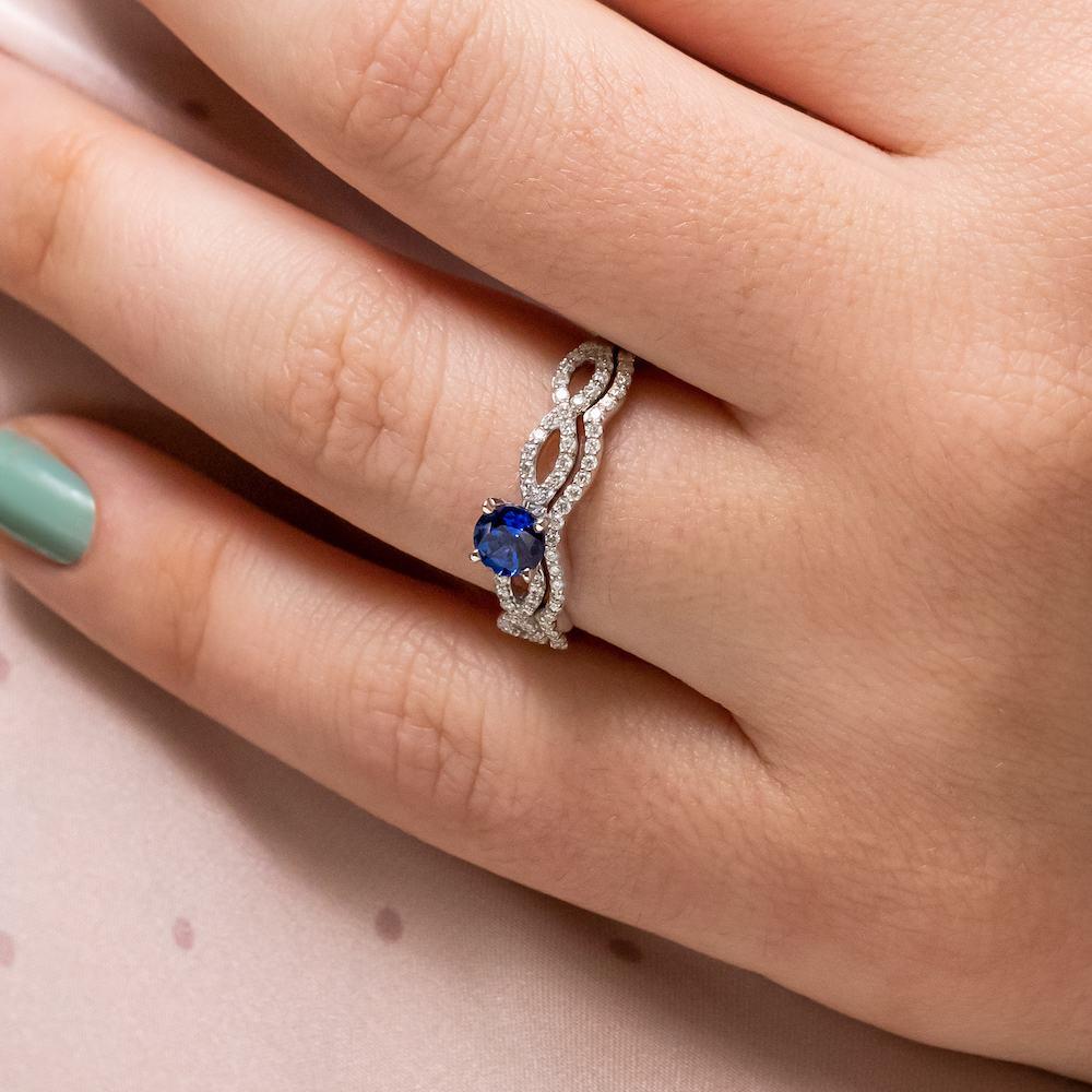 Shown with 1ct Round Cut Lab Created Blue Sapphire in 14k White Gold with Matching Band