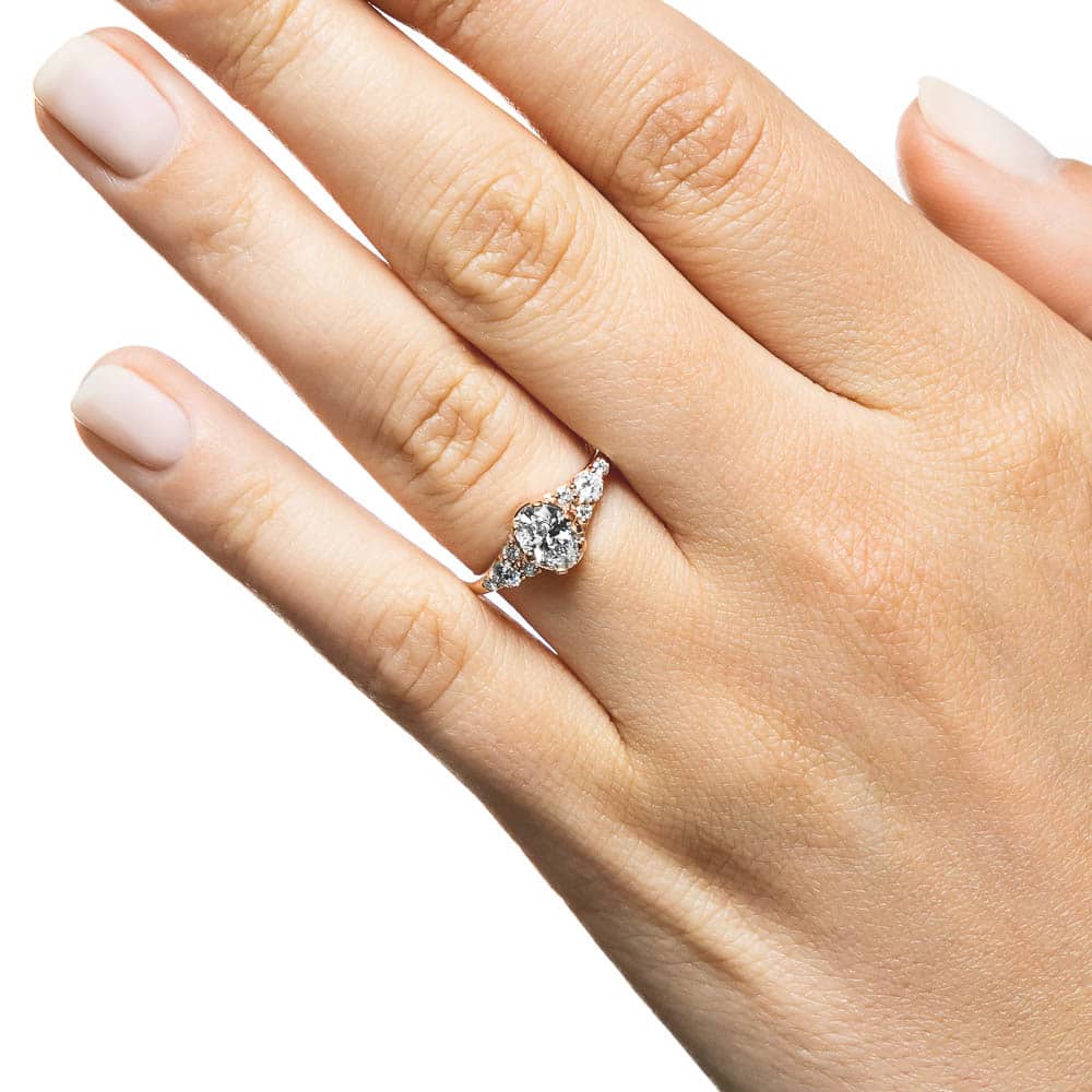 Shown with a 1.0ct Oval cut Lab-Grown Diamond in recycled 14K rose gold with accenting stones